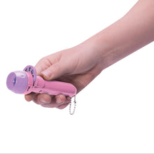 Load image into Gallery viewer, Hand holding a pink projector torch with a keychain on a white background