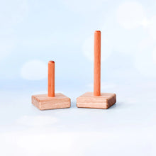 Load image into Gallery viewer, Two wooden stand-up items with vertical sticks on a light blue background