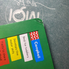 Load image into Gallery viewer, Green book with Campbell branding and text on a gray surface
