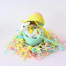 Load image into Gallery viewer, Small white Unicorn toy in a green egg with colorful grass on a light pink background
