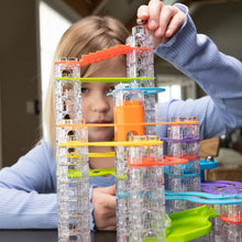 Load image into Gallery viewer, Person playing with a colorful marble run toy
