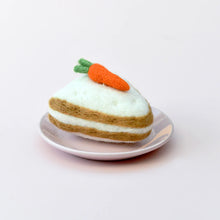 Load image into Gallery viewer, Toy cake with a carrot on a white plate against a light gray background
