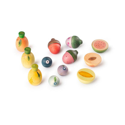Set of colorful wooden fruit toys on a white background