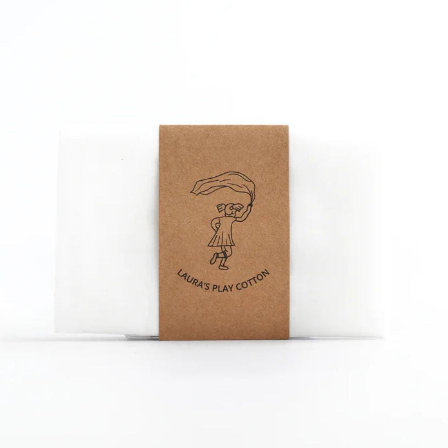 Kraft paper packaging with a printed design and white cotton fabric, on a white background