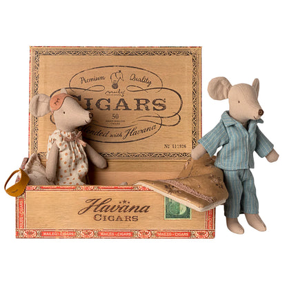 Two toy mice in a decorative Havana Cigars box on a white background