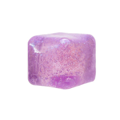 Purple glittery cube on a white background